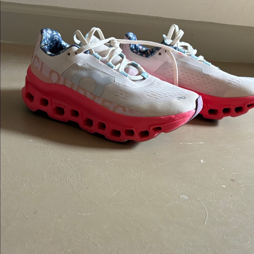 On Running White and Pink Athletic Shoes